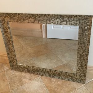 Metallic trim beveled mirror